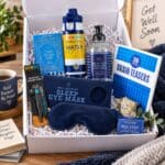 Men’s get well soon gift hamper in open white gift box with recovery, relaxation and self-care gifts