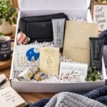 Men’s hospital gift box in open white box with practical grooming, relaxation and recovery gifts