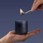 Smoked Suede And Bergamot Candle Being Lit