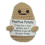 Positive Potato mini handmade crochet plush holding an encouragement message card for adults