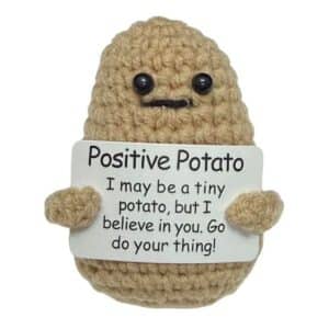 Positive Potato mini handmade crochet plush holding an encouragement message card for adults