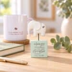 You Are Strong Sentiment Block with white elephant and silver heart styled on a softly sunlit desk