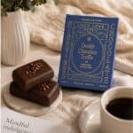 Dark chocolate truffle twin pack open with a cup of black coffee