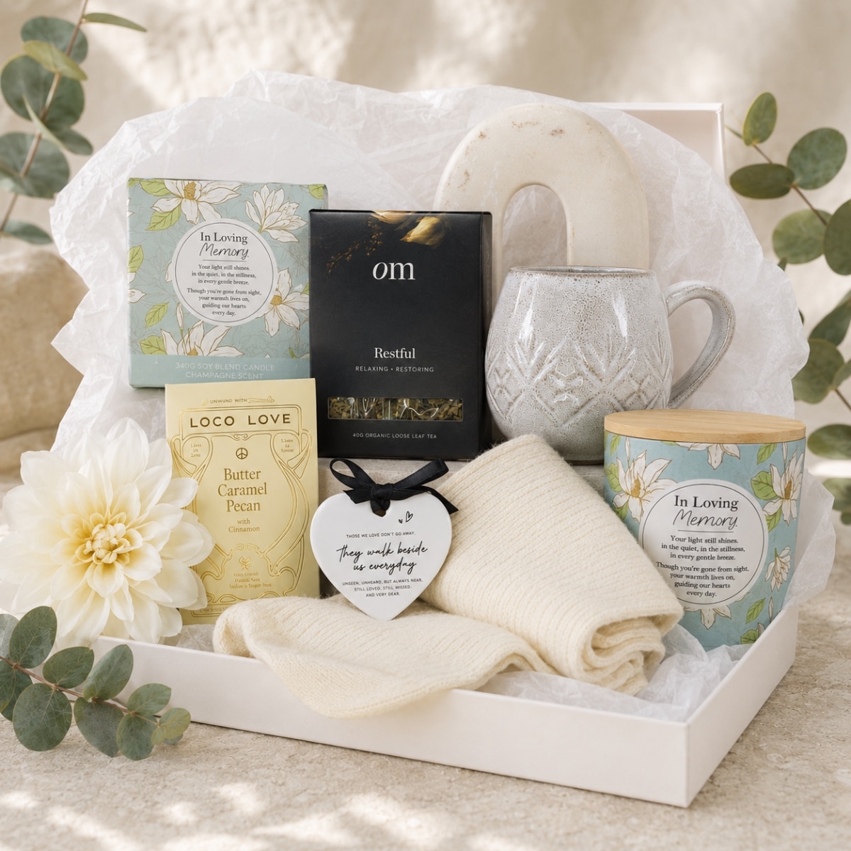 In Our Hearts Sympathy Hamper with a remembrance candle, memorial keepsake, comforting tea, mug and cream heat pillow.