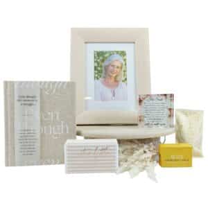 Her Smile Sympathy and Memorial Gift Hamper in a white gift box with an Even Though book, memorial photo frame, verse block, chocolate and shower steamer.