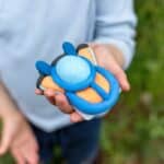 Pull back hovercraft clay craft kit finished and ready to play in childs hand