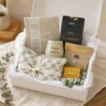 open Always In OUr Hearts Sympathy Hamper with heat pillow, candle holder, book, herbal tea, wildflower seeds and shower steamer