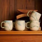 Unique blue and green marbled stoneware mug with individual coloured clay pattern