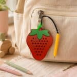 Strawberry Magnetic Pad Keyring Sensory Toy on Backpack