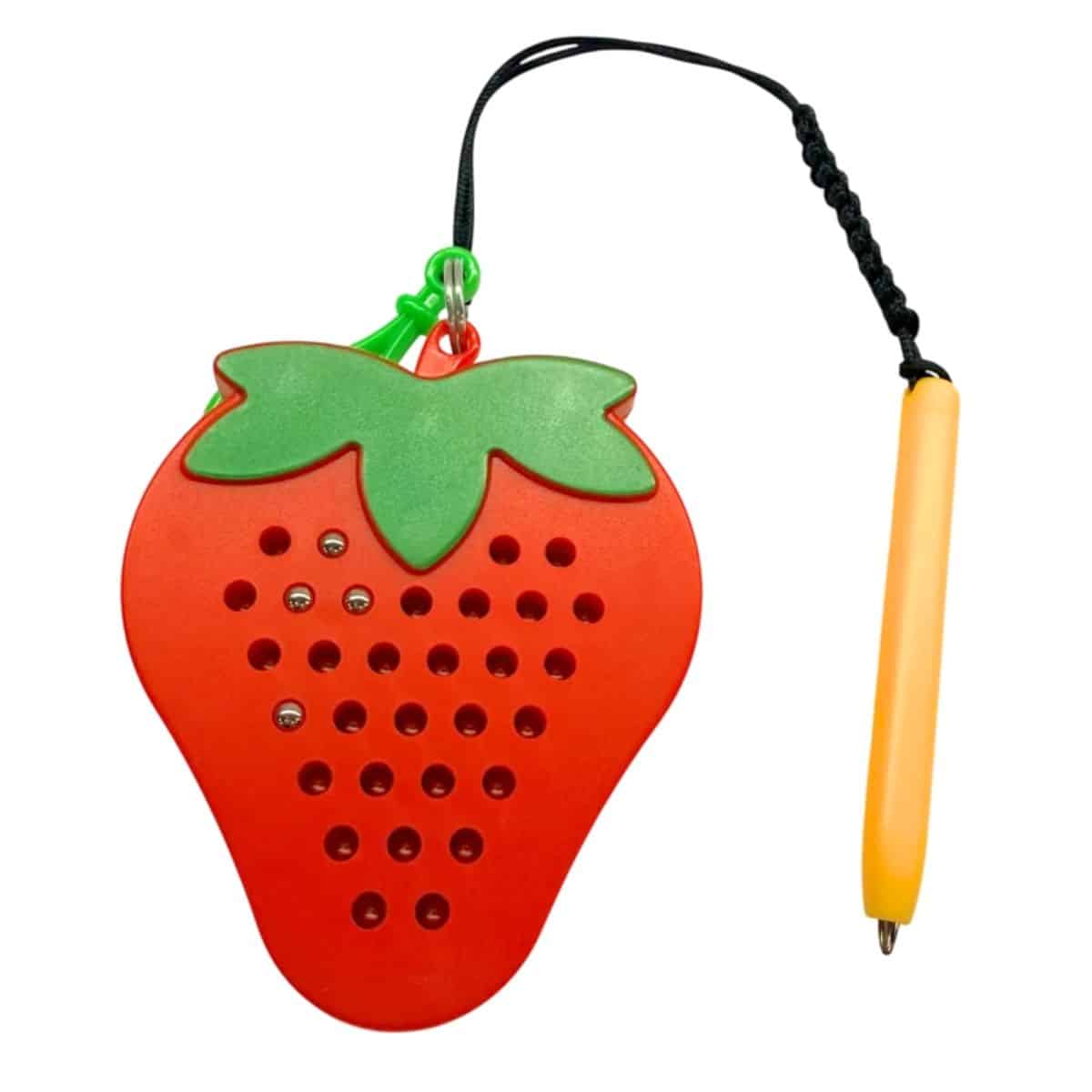 A pocket-sized strawberry magnetic pad with stylus for reusable tactile bead play.