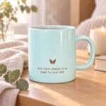 Angel Wing Ceramic Mug styled with tea, soft linen and eucalyptus in a warm comforting setting