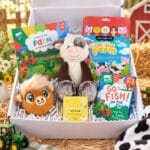 Farm activity gift box for kids aged 3–7 with Buttercup Cow, puzzles, colouring and games