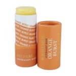 Lid off the cardboard tubing showing the balm for the Orange Burst Natural Lip Balm