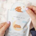 Getting ready to put on a kids Moonlight Aromatherapy Sleep Sticker