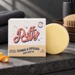 Ruffy exfoliating body buffer soap bar styled with natural bath and self-care essentials