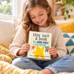 Child enjoying This Isn’t a Book It’s Good Vibes in Disguise, an uplifting hardcover book filled with cheerful rhymes and colourful illustrations