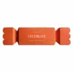 Wild Emery Celebrate Bath Salt Bon Bon 70g, Australian-made Christmas bath salts in orange festive packaging with gold stars.