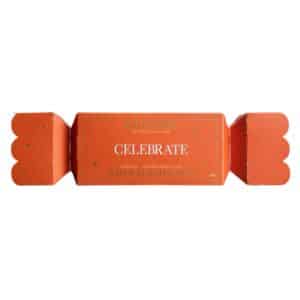 Wild Emery Celebrate Bath Salt Bon Bon 70g, Australian-made Christmas bath salts in orange festive packaging with gold stars.